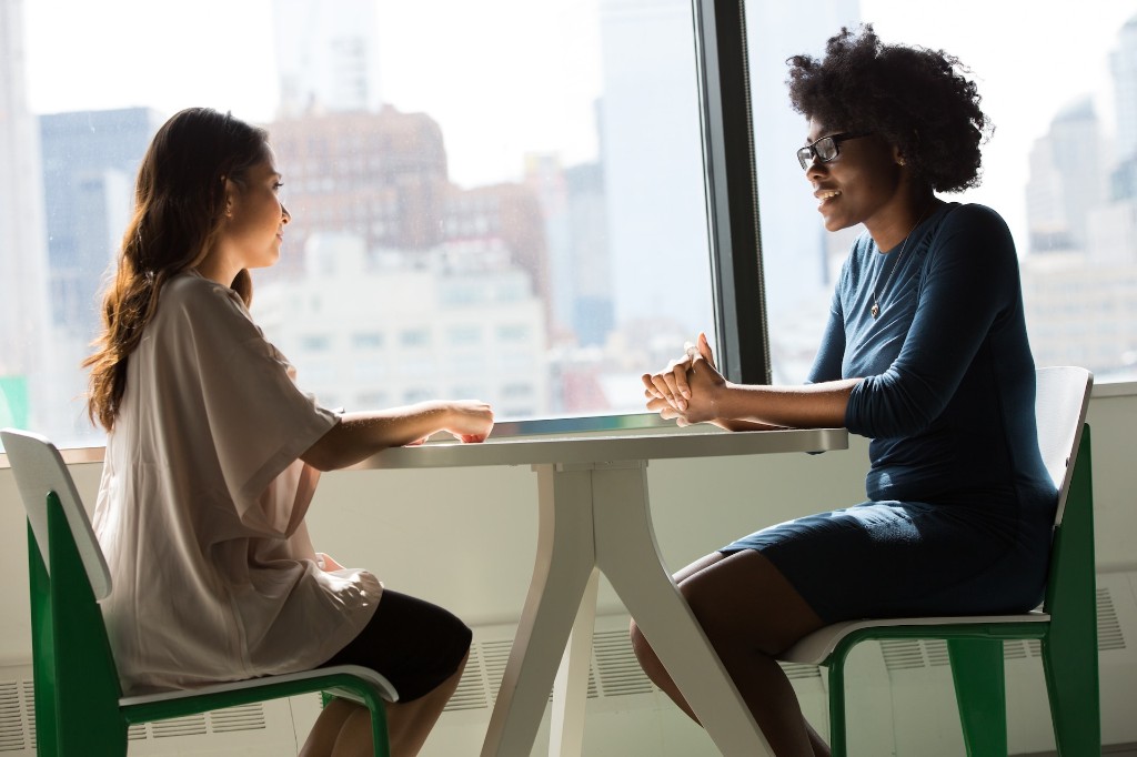 A specialist speaking with a patient at the Blackburn hybrid clinic