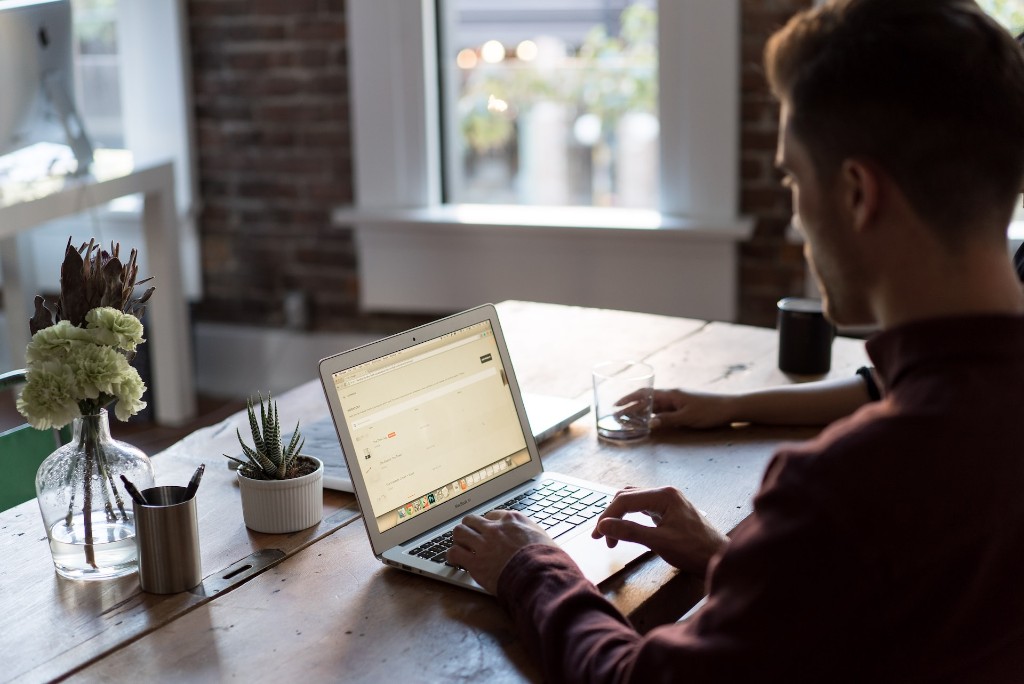 A patient accessing partner-program care from a laptop at home